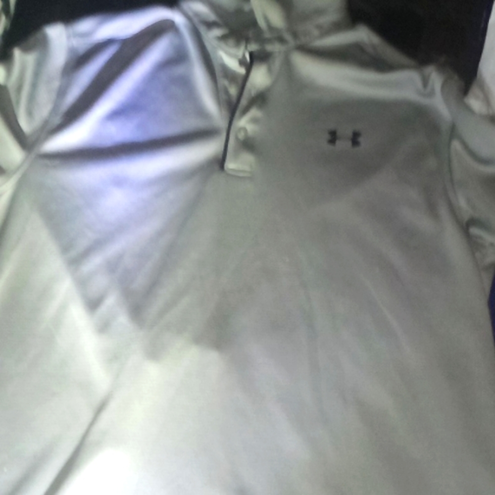 Like New Under Armour all grey Polo shirt Size Med.Retail $55.Yours for only $18